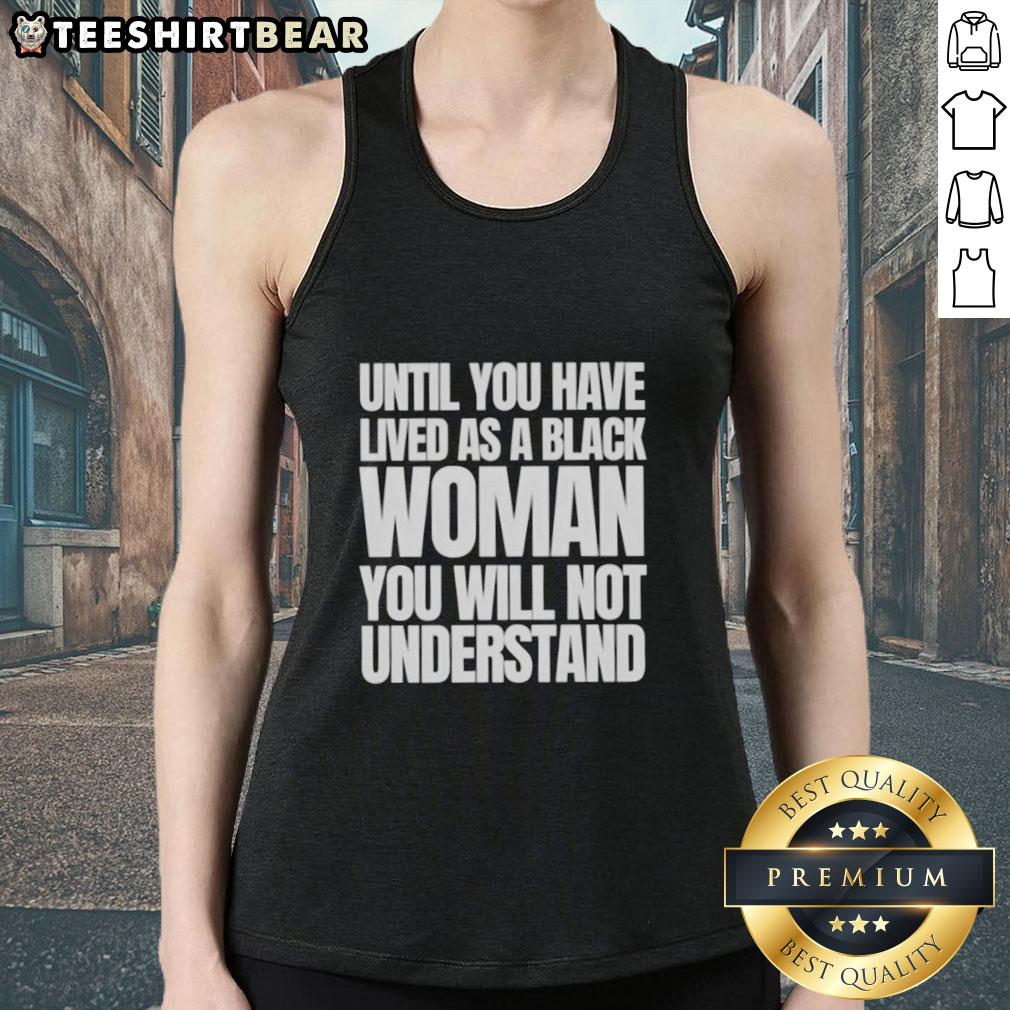 Black woman wearing a 'Nice Until You Have Lived as a Black Woman' tank top, showcasing empowerment and identity.
