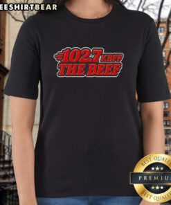 Alt Text: Official KBFF 102.7 The Beef Ladies Tee featuring a stylish design and vibrant colors for fans of the radio station.