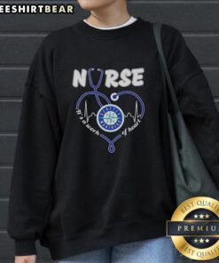 Alt Text: Original Seattle Mariners Nurse sweatshirt featuring 'It's a Work of Heart' design in vibrant colors.