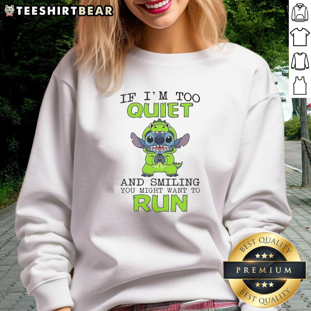 Original Stitch wearing green hoodie with 'If I'm too quiet and smiling, you might want to run' sweatshirt design.