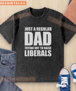 Alt Text: Premium Just A Regular Dad Trying Not To Raise Liberals Humor Washed T-Shirt in a casual setting, showcasing humor and style.