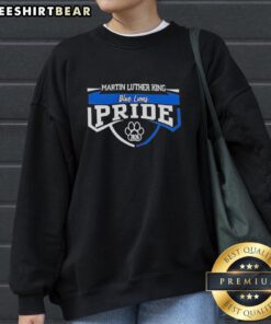 Alt Text: Premium Martin Luther King sweatshirt featuring a blue lions pride paw print graphic for the 2026 class year.