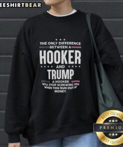 Premium sweatshirt featuring the phrase 'The Only Difference Between A Hooker And Trump' for bold political statements.