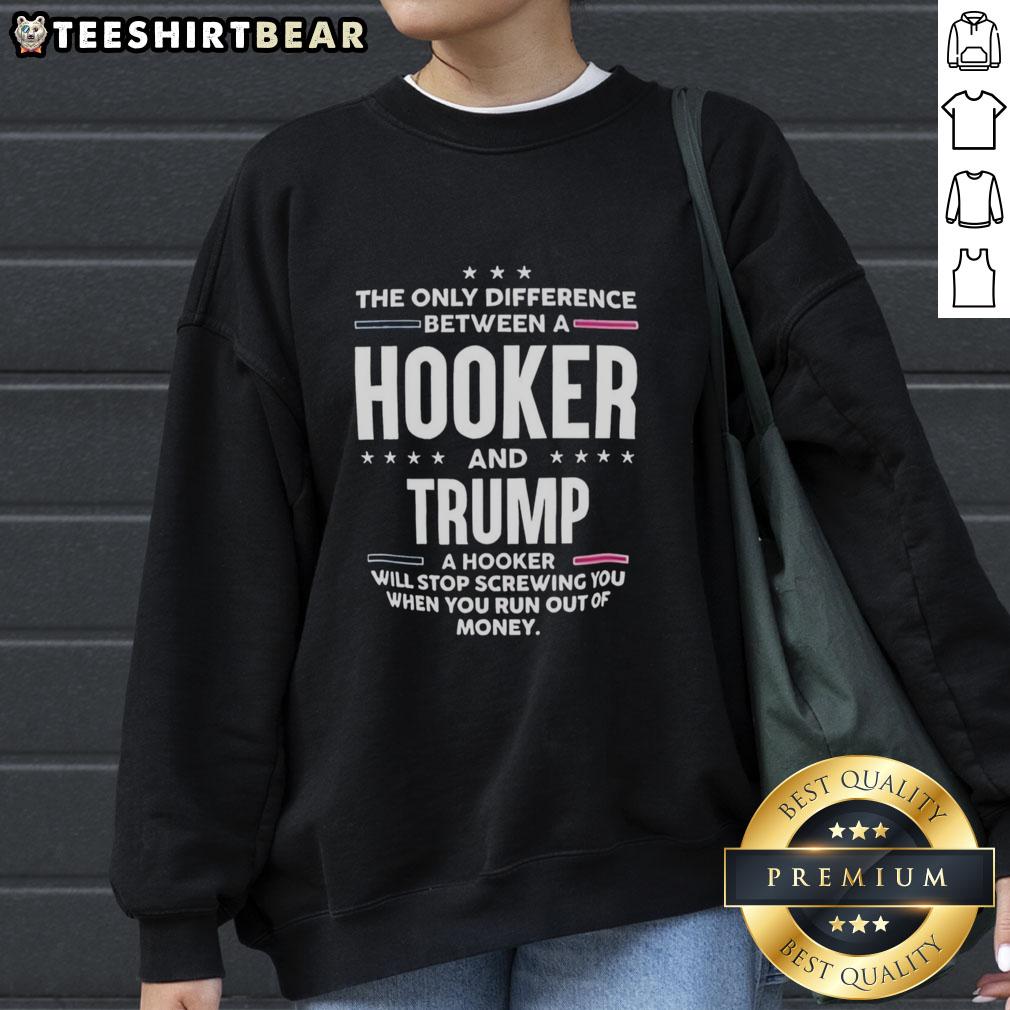 Premium sweatshirt featuring the phrase 'The Only Difference Between A Hooker And Trump' for bold political statements.