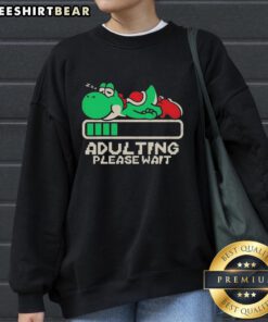 Premium Yoshi Adulting Please Wait Sweatshirt featuring a playful Yoshi graphic, perfect for gamers and casual wear.