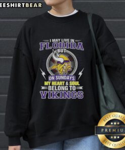 Alt Text: Cozy Minnesota Vikings sweatshirt with I may live in Florida, but my heart belongs to the Vikings design.