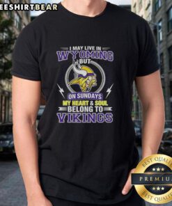 Alt Text: Pretty Minnesota Vikings NFL t-shirt design: 'I May Live In Wyoming, My Heart Belongs To Vikings' in vibrant colors.