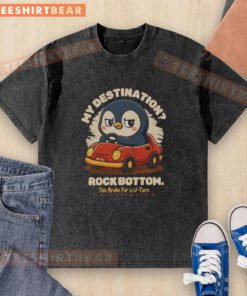 Funny penguin graphic on 'Rock Bottom' washed t-shirt, perfect for casual wear and expressing humor about life's struggles.