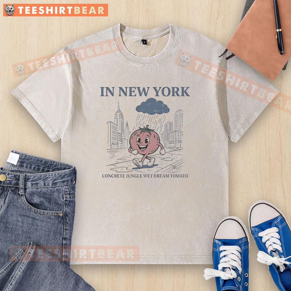 Pretty tomato walking in the rain in New York's concrete jungle, showcasing the Wet Dream tomato washed t-shirt.