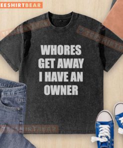 Model wearing a 'Pretty Whores Get Away, I Have an Owner' text washed t-shirt in a trendy urban setting.