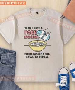 Person enjoying a big bowl of cereal while wearing a washed T-shirt, reflecting on a porn addiction.