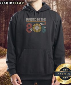 Alt Text: Top I Was Raised In The 80s Hoodie featuring retro design and vibrant colors, perfect for nostalgic fashion lovers.