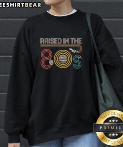 Top I Was Raised In The 80s Sweatshirt in vibrant colors, showcasing retro style and nostalgia for 1980s fashion.
