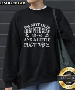 Funny sweatshirt with 'I'm Not Old, I Just Need WD-40 and Duct Tape' slogan for humor-loving adults.
