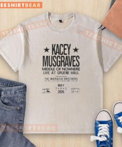 Kacey Musgraves performing live at Gruene Hall 2026, wearing a stylish washed t-shirt in a vibrant concert setting.