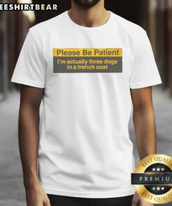 Alt Text: Funny 'Please Be Patient Im Actually Three Dogs In A Trench Coat' T-Shirt design featuring three cartoon dogs.