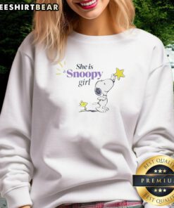 Alt Text: Cozy 'She Is A Snoopy Girl' sweatshirt featuring playful Snoopy graphics, perfect for casual outings and fans of Peanuts.