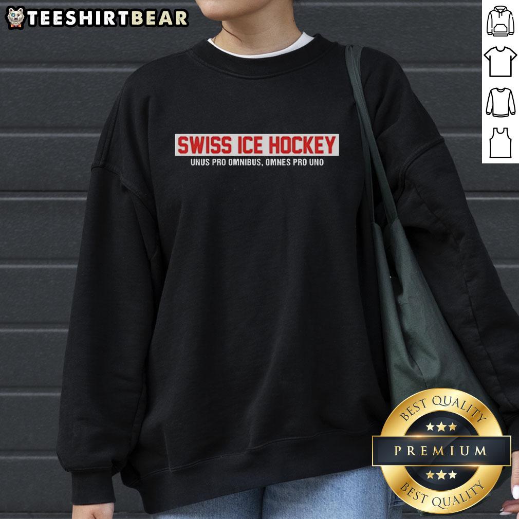 Alt Text: Top Swiss Ice Hockey sweatshirt featuring 'Unus Pro Omnibus, Omnes Pro Uno' in bold red text on a stylish design.