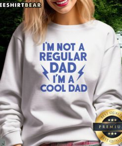 Good I'M Not A Regular Dad I'M A Cool Dad Sweatshirt displayed on a hanger, showcasing its comfortable fit.