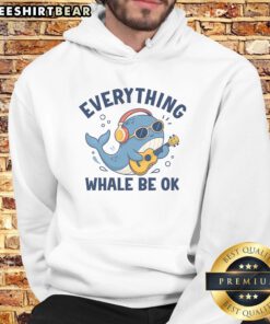 Official Everything Whale Be OK Hoodie displayed on a wooden background, showcasing its vibrant design and cozy fit.