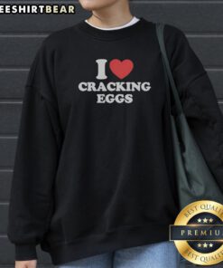 Official I Love Cracking Eggs Heart Shape Sweatshirt in a cozy fit, perfect for egg lovers.