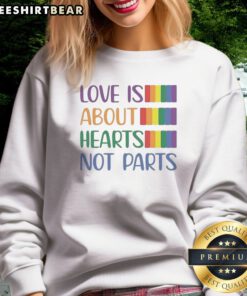 Original Love Is About Hearts Not Parts Pride Month Sweatshirt in vibrant colors, perfect for celebrating pride.