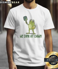 Premium We Dink At Dawn Pickle Ball Shirt featuring a playful design for pickleball enthusiasts.