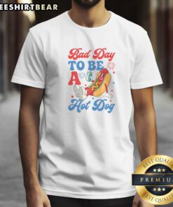 Top Bad Day To Be A Hot Dog Funny 4th Of July Summer Shirt displayed on a flat lay background.