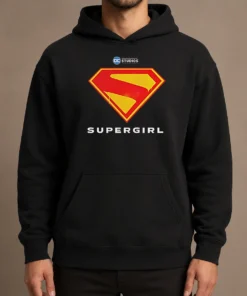 Awesome Supergirl DC Studios Logo Hoodie in black with front graphic print, displayed on a flat lay