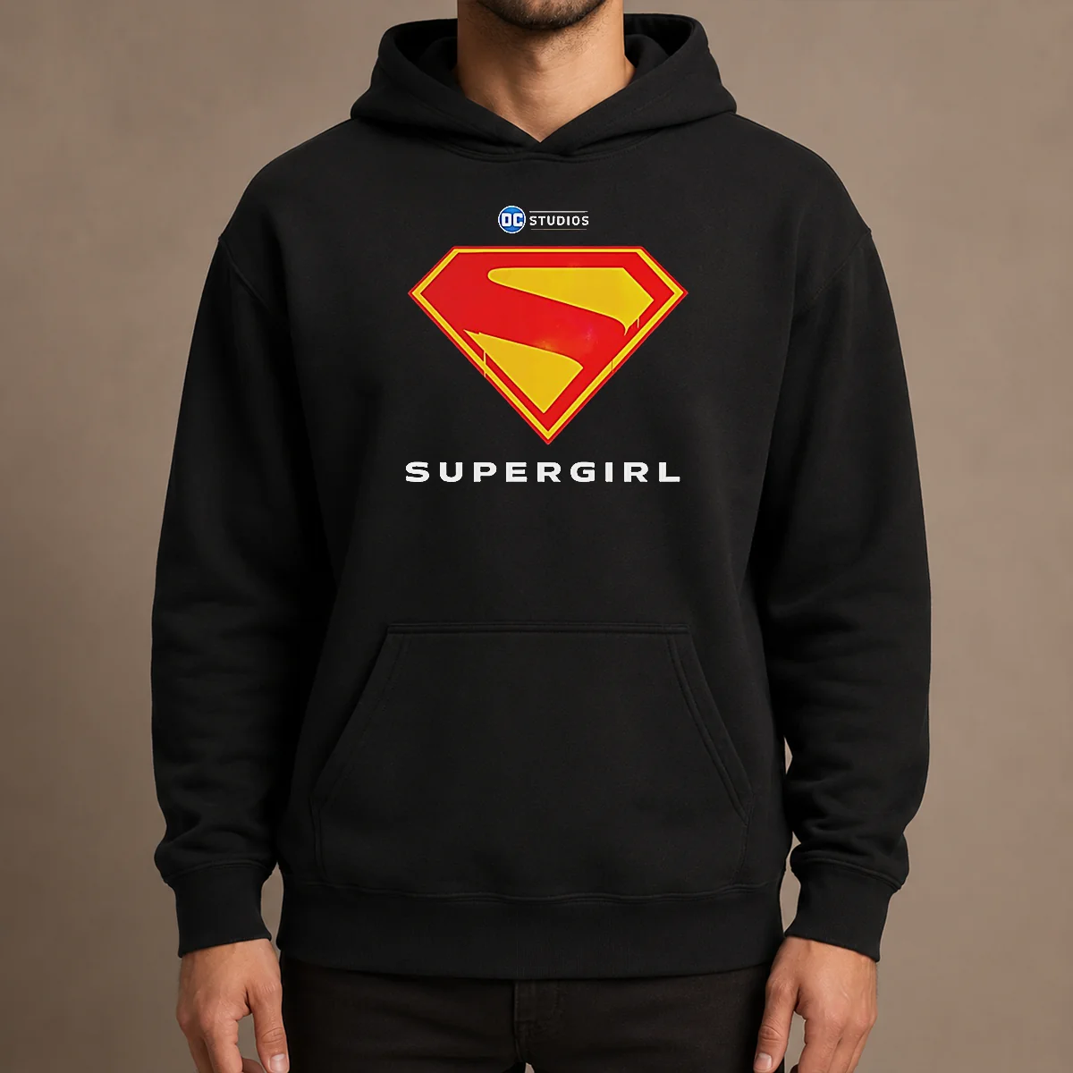 Awesome Supergirl DC Studios Logo Hoodie in black with front graphic print, displayed on a flat lay