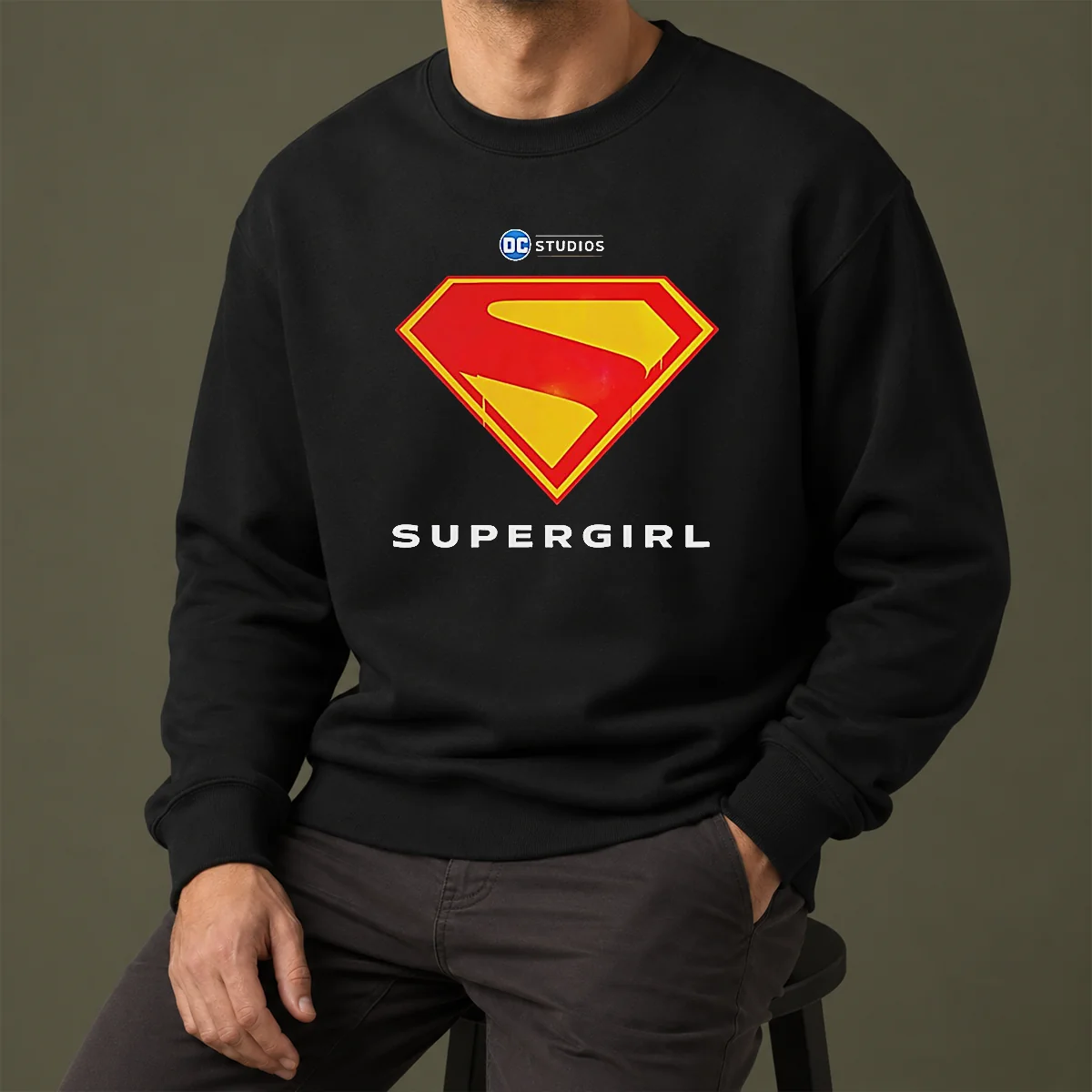 Awesome Supergirl DC Studios Logo Sweater in charcoal gray, featuring a bold graphic on the front