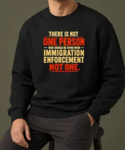 Good There Is Not One Person WHO Should Be Dying From Immigration Enforcement Sweater in black, long-sleeve crewneck made of soft cotton blend