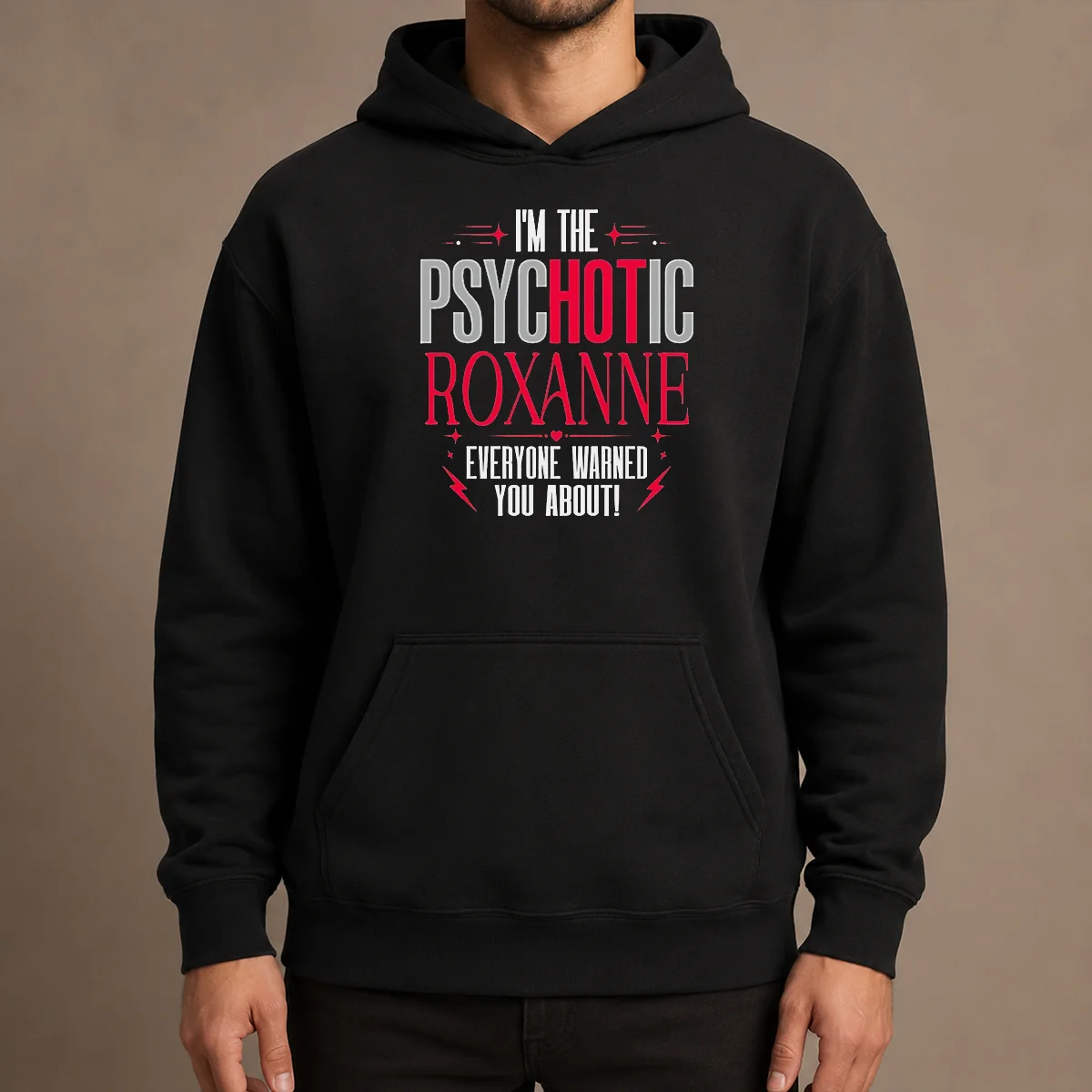 Top I'M The Psychotic Roxanne Everyone Warned You About Hoodie in black, front view with drawstring hood and kangaroo pocket
