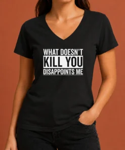 Top Official What Doesn'T Kill You Disappoints Me V Neck shirt in black with bold white text on chest